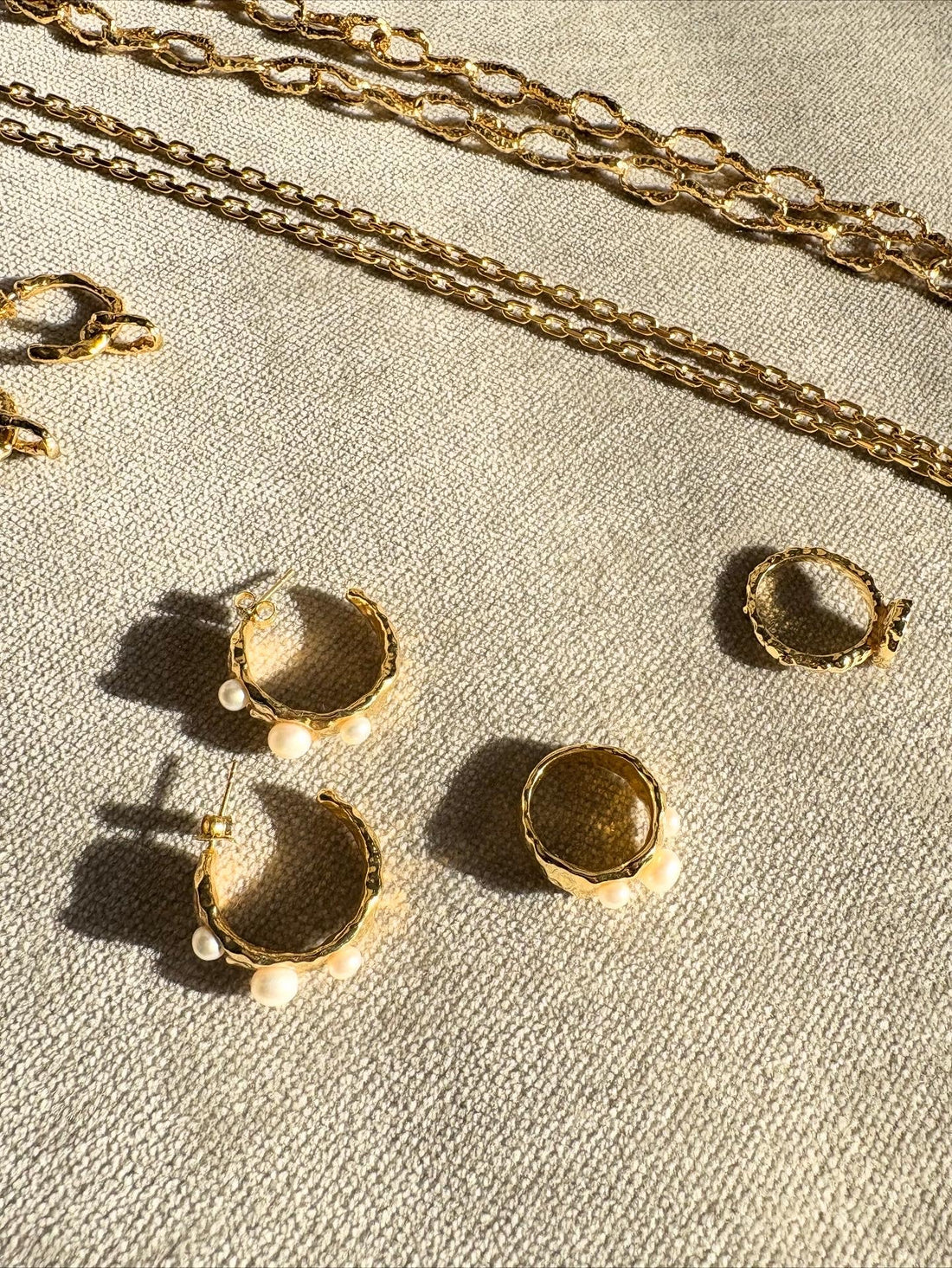 Gold fashion jewellery that can build you forever jewellery wardrobe. Consisting of organic looking fashion gold chain necklaces, gold hoops and rings with pearls and plain hoop earrings